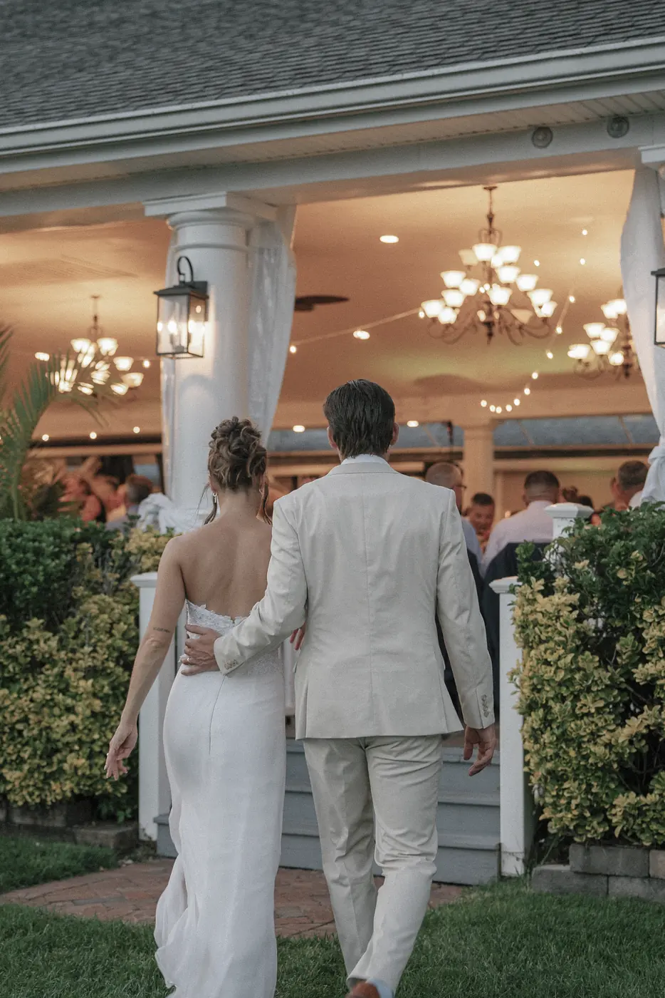 Newlyweds walking toward their reception venue