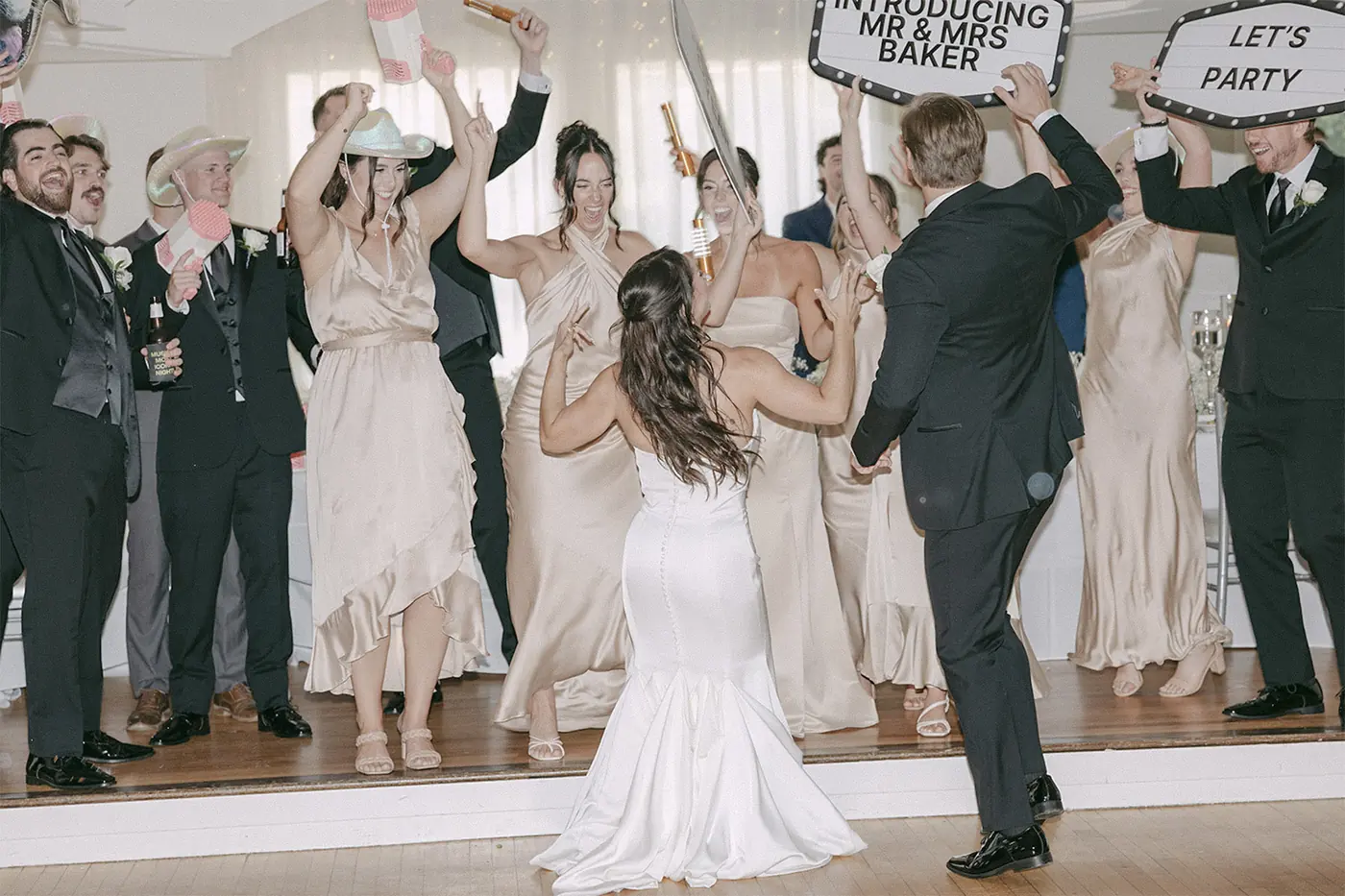 The VARA DJs entertainers engaging wedding guests during a lively wedding reception.
