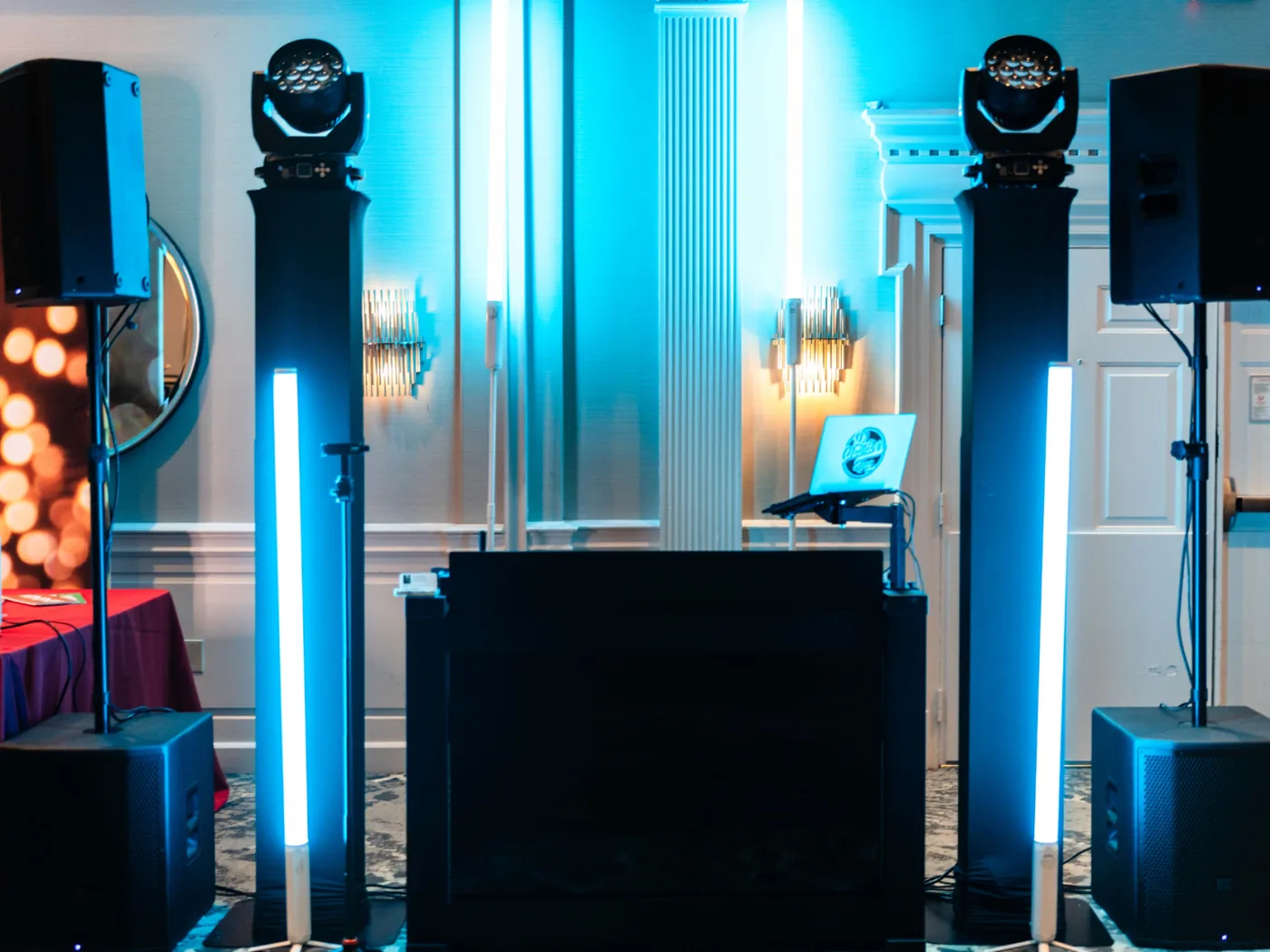 VARA DJs sound and lighting setup with blue light towers at a wedding