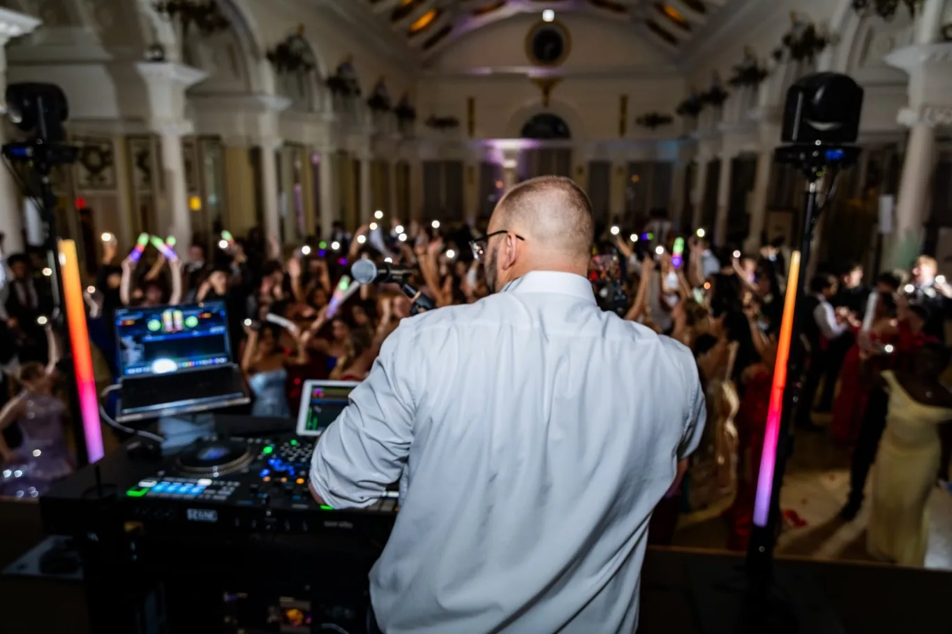 VARA DJ at the booth facing guests on the dance floor