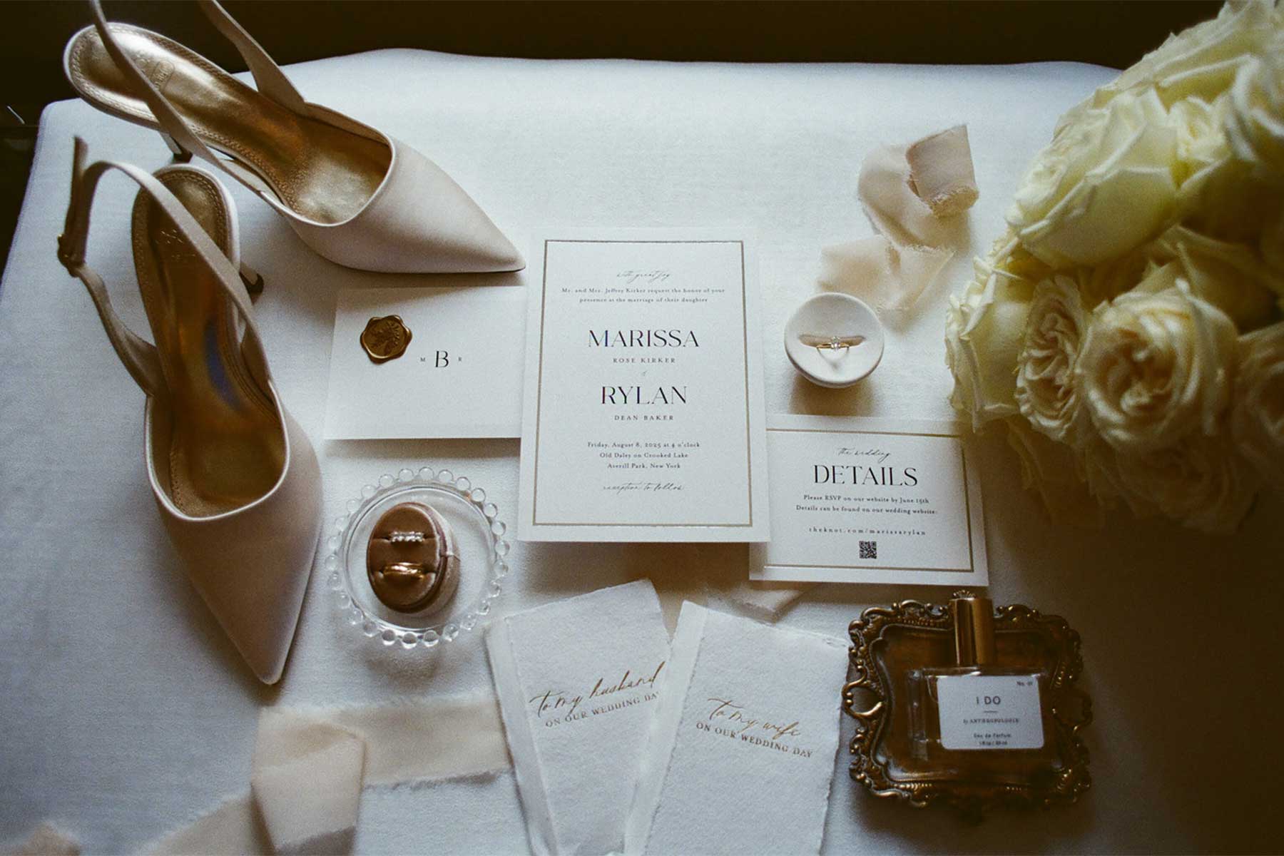 Wedding Invitation & Details | VARA DJs Wedding invitation, bridal shoes, rings, bouquet, and accessories photographed as part of an elegant wedding day before a reception with VARA DJs.