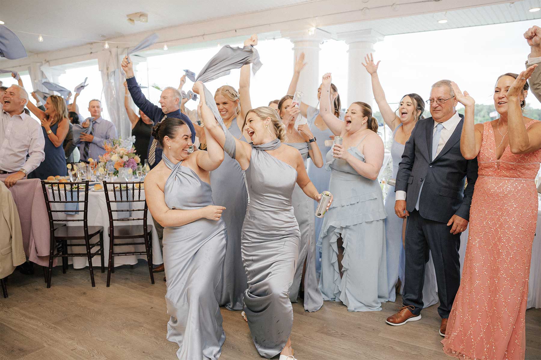Wedding Reception Entertainment | VARA DJs Guests enjoying an energetic wedding reception with professional DJ entertainment, crowd interaction, and a packed dance floor by VARA DJs.
