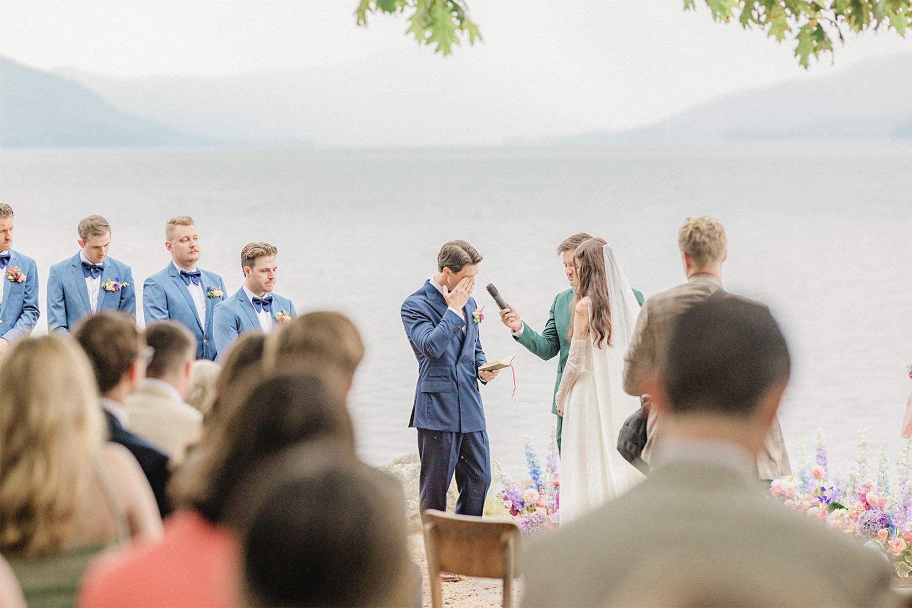 A bride and groom exchange emotional vows during an outdoor wedding ceremony with professional ceremony sound and wireless microphone services by VARA DJs.